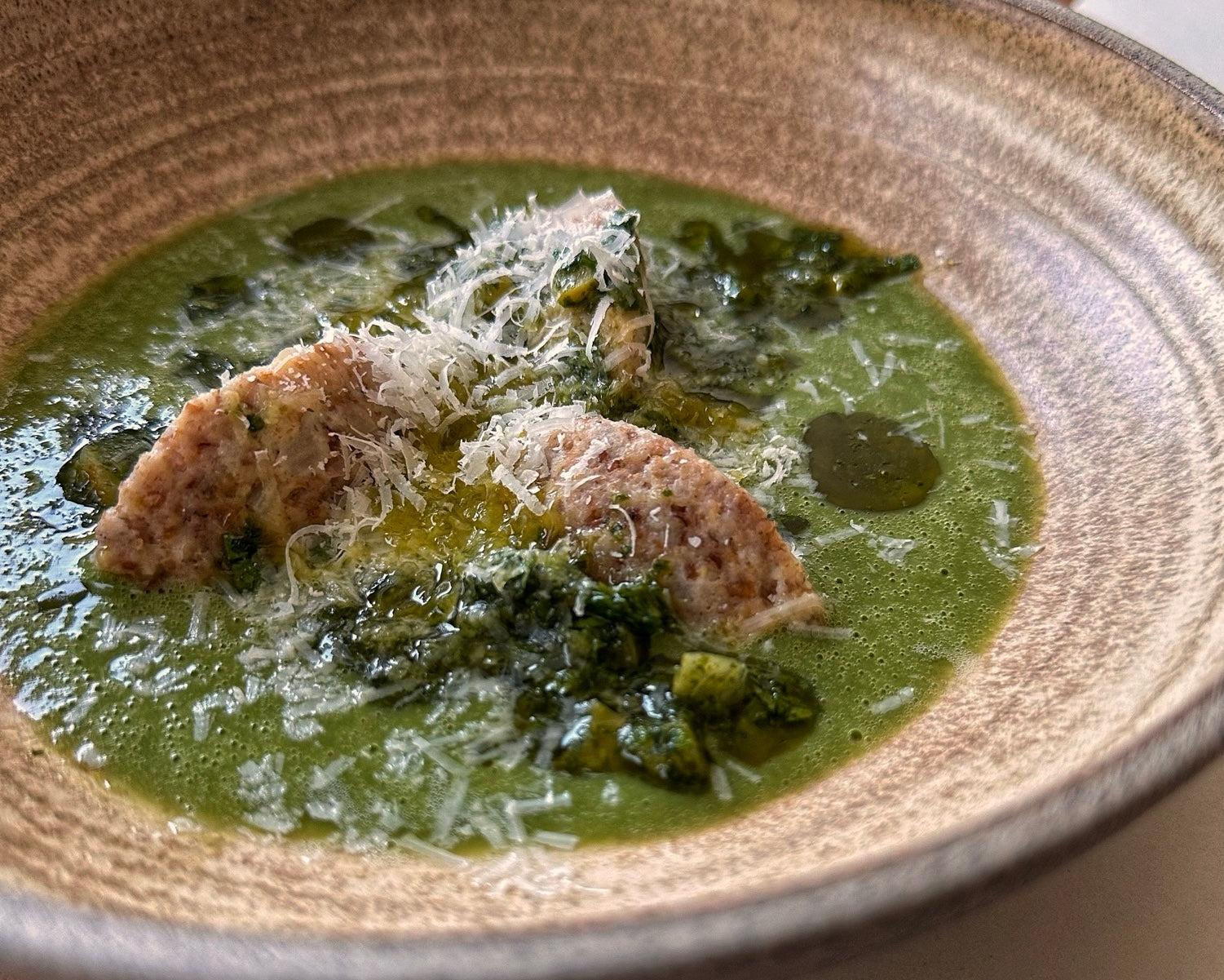 Brioche and rye dumplings in white bean sauce with a preserved lemon salsa verde