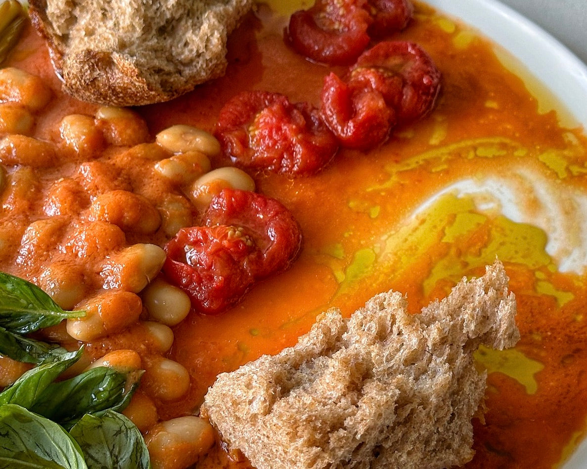 Cherry tomatoes, wet garlic, butter beans and tomato vine-infused Honest Toil, Scarpetta style
