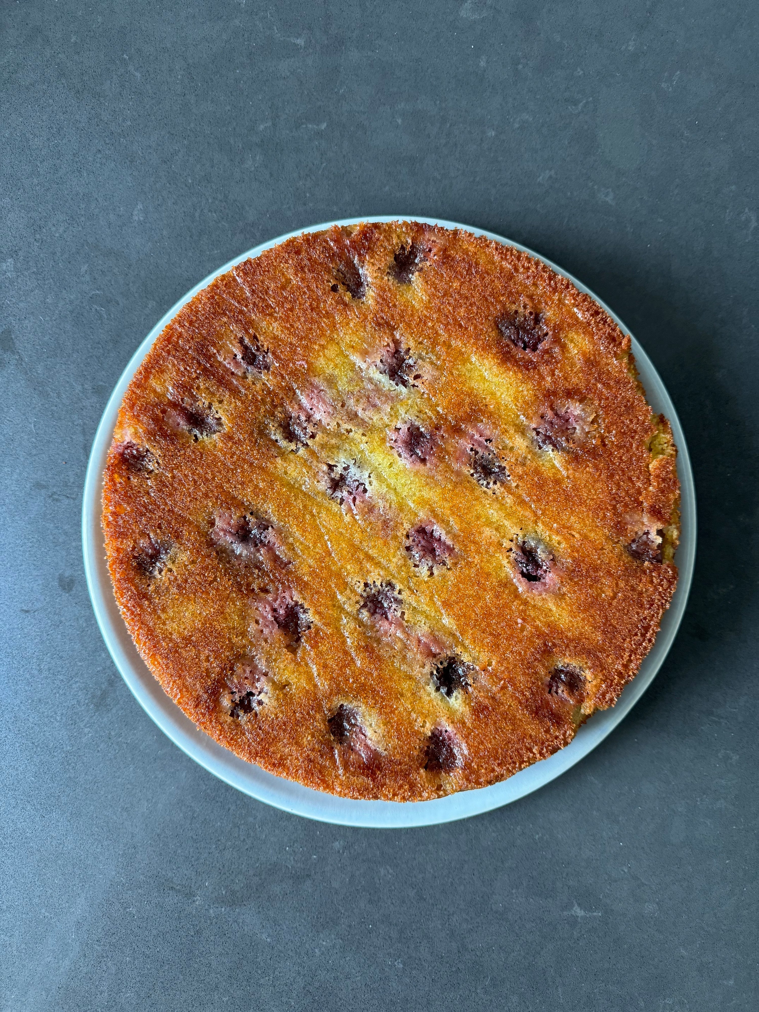 Cherry, cardamom & olive oil cake - by Tomek Mossakowski
