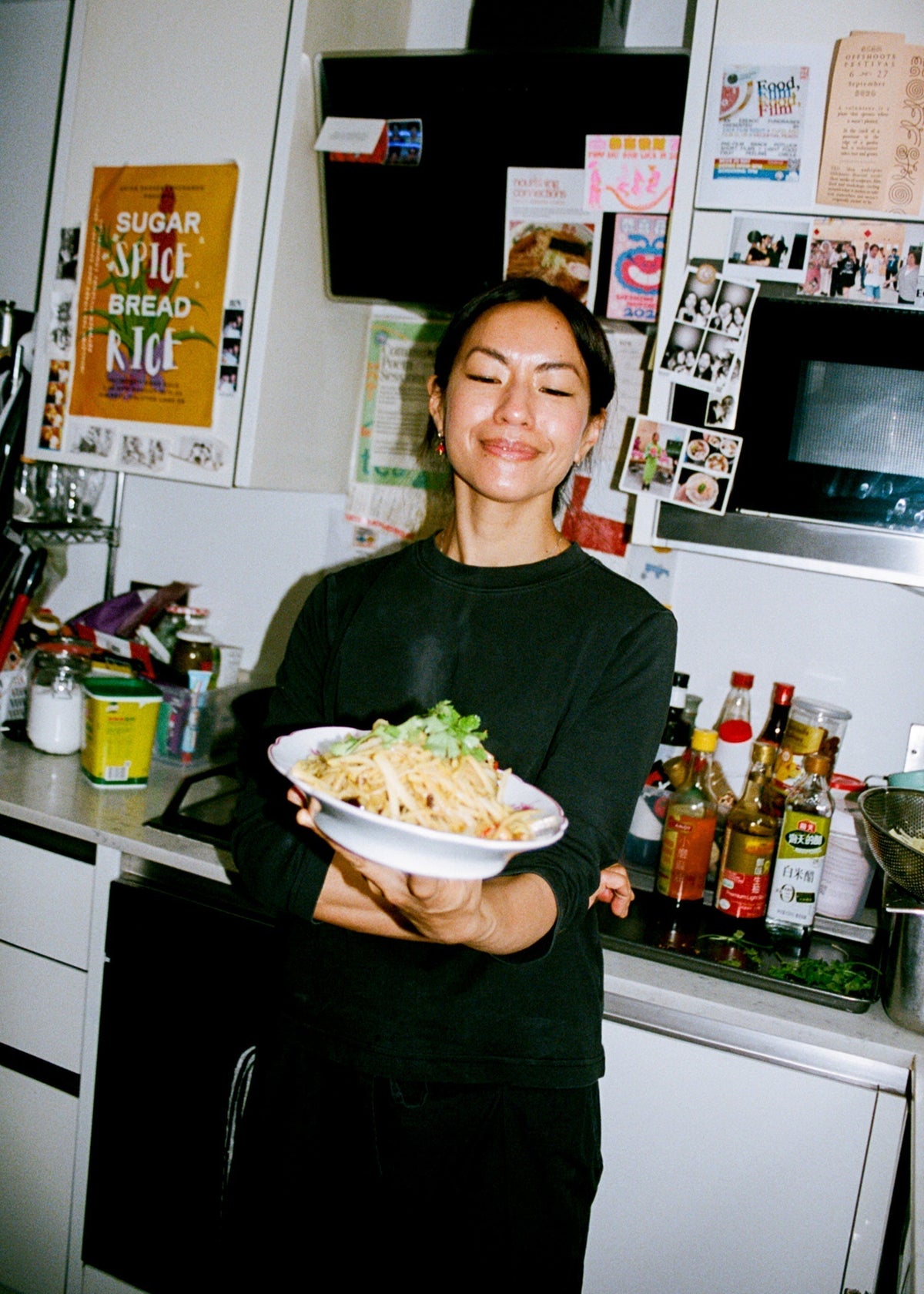 Jenny Lau at home in south-east London, holding her Sichuan shredded potato stir-fry