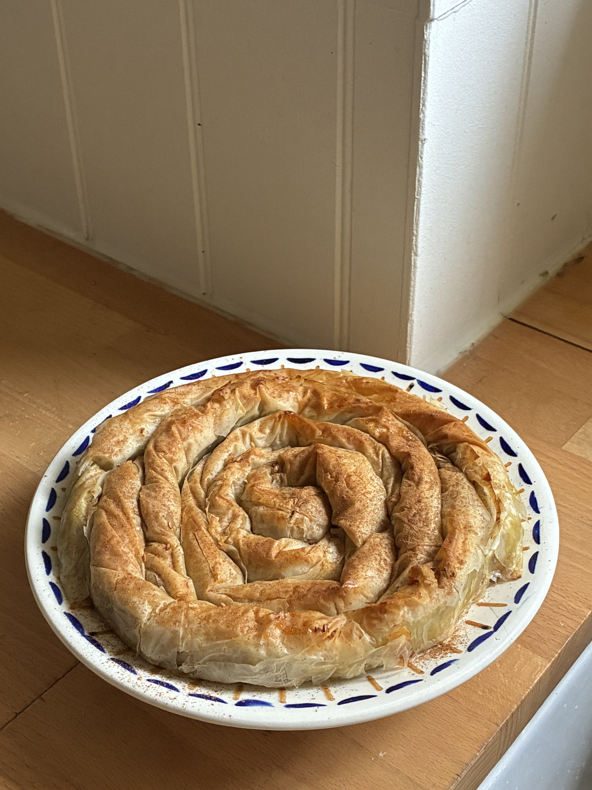 Kolokithopita Glykia, a sweet Greek filo pie, plated and dusted with cinnamon