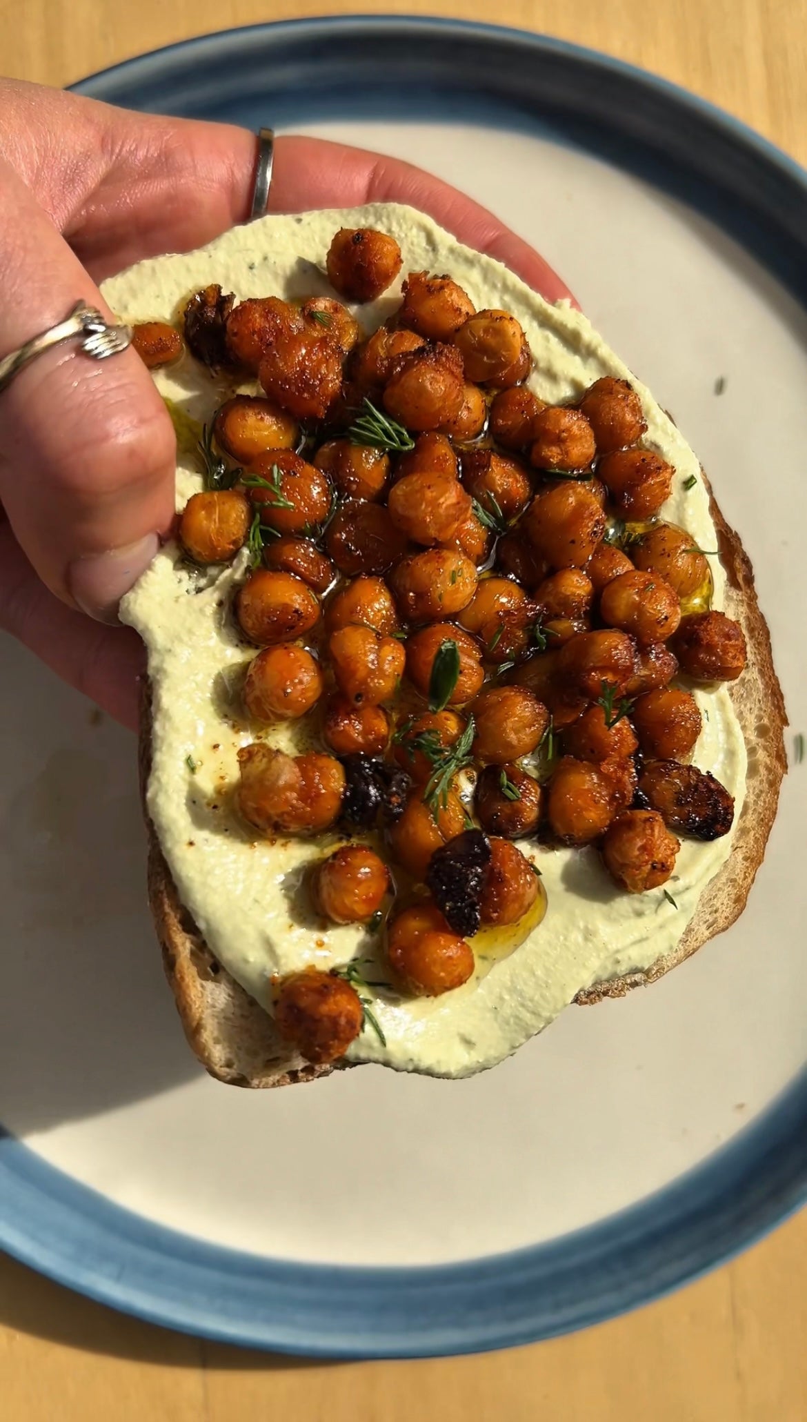 Tofu ricotta toast with crispy chickpeas, a high protein, high fibre vegan snack finished with Honest Toil olive oil